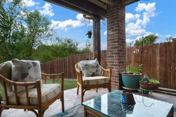 a kitchen with stainless steel appliances granite countertop a refrigerator a stove and a refrigerator