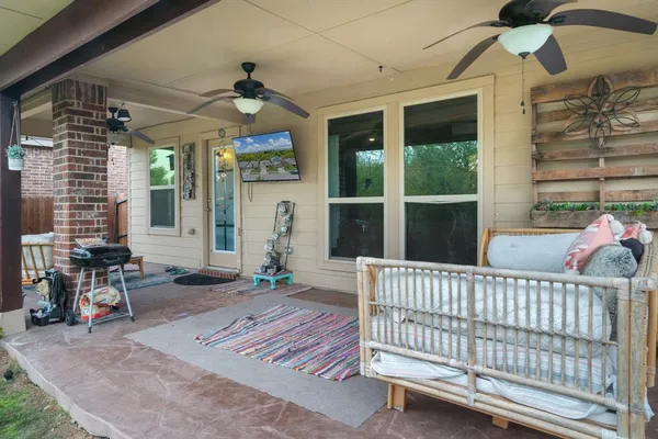 a balcony with outdoor seating and plants