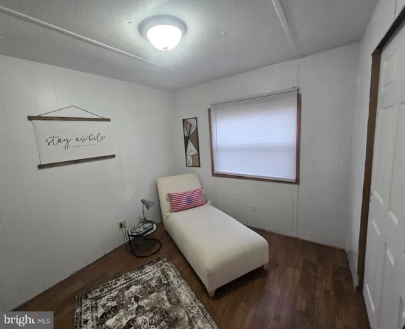 a bedroom with a bed and a walk in closet