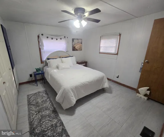 a en suite bathroom with a sink vanity and mirror