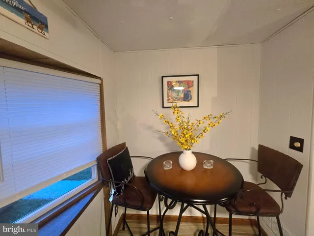 a view of a chairs and table in a room