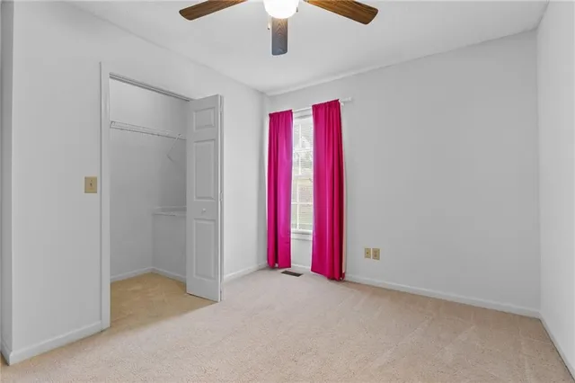 a view of a room with air conditioner and a window