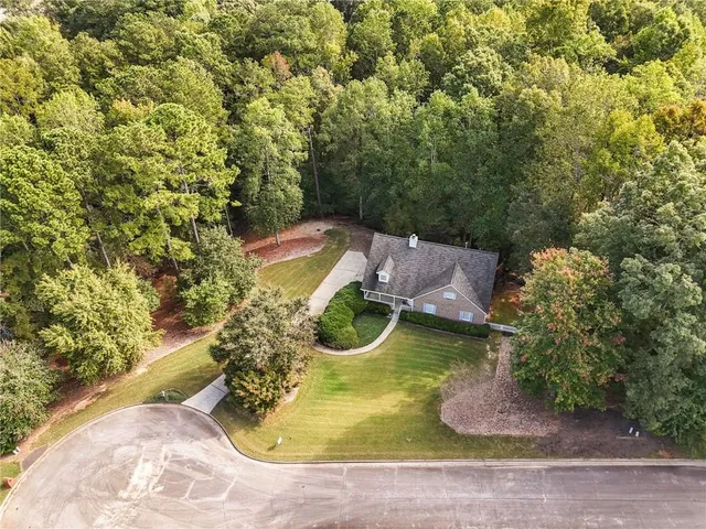 a view of a swimming pool with a yard