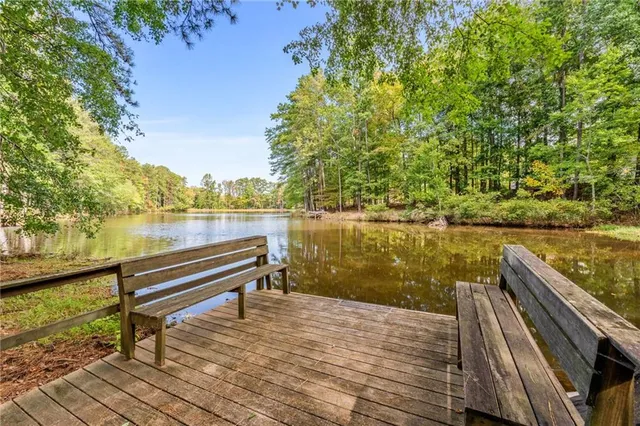 a view of a lake with an outdoor seating