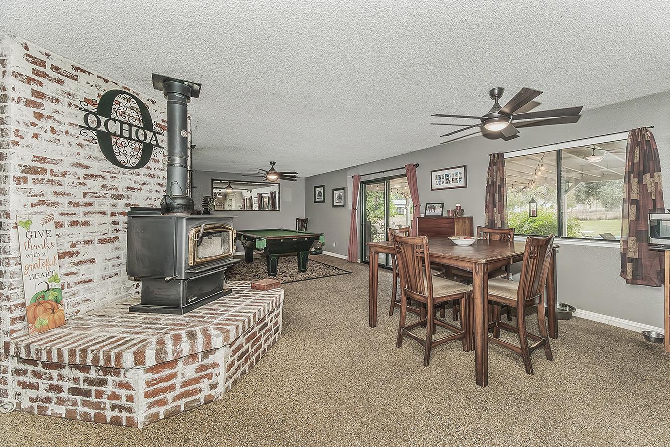 29545 Oak Meadow Road Tollhouse, CA 93667 - Photo 17 of 69 a living room with furniture a flat screen tv and a table
