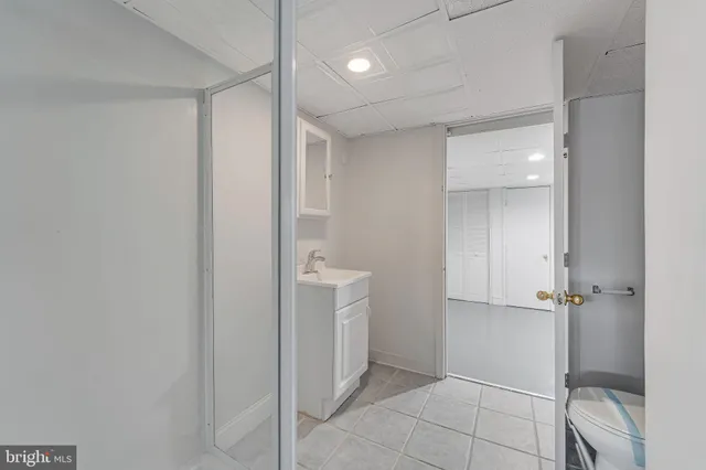 a bathroom with a shower and a toilet