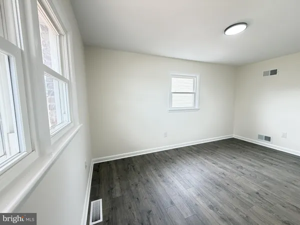 a white toilet sitting next to a bath tub