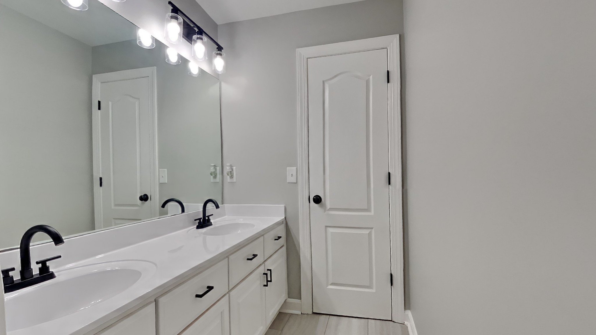 1024 Nina Drive Springfield, TN 37172 - Photo 11 of 16 a bathroom with a double vanity sink and a mirror