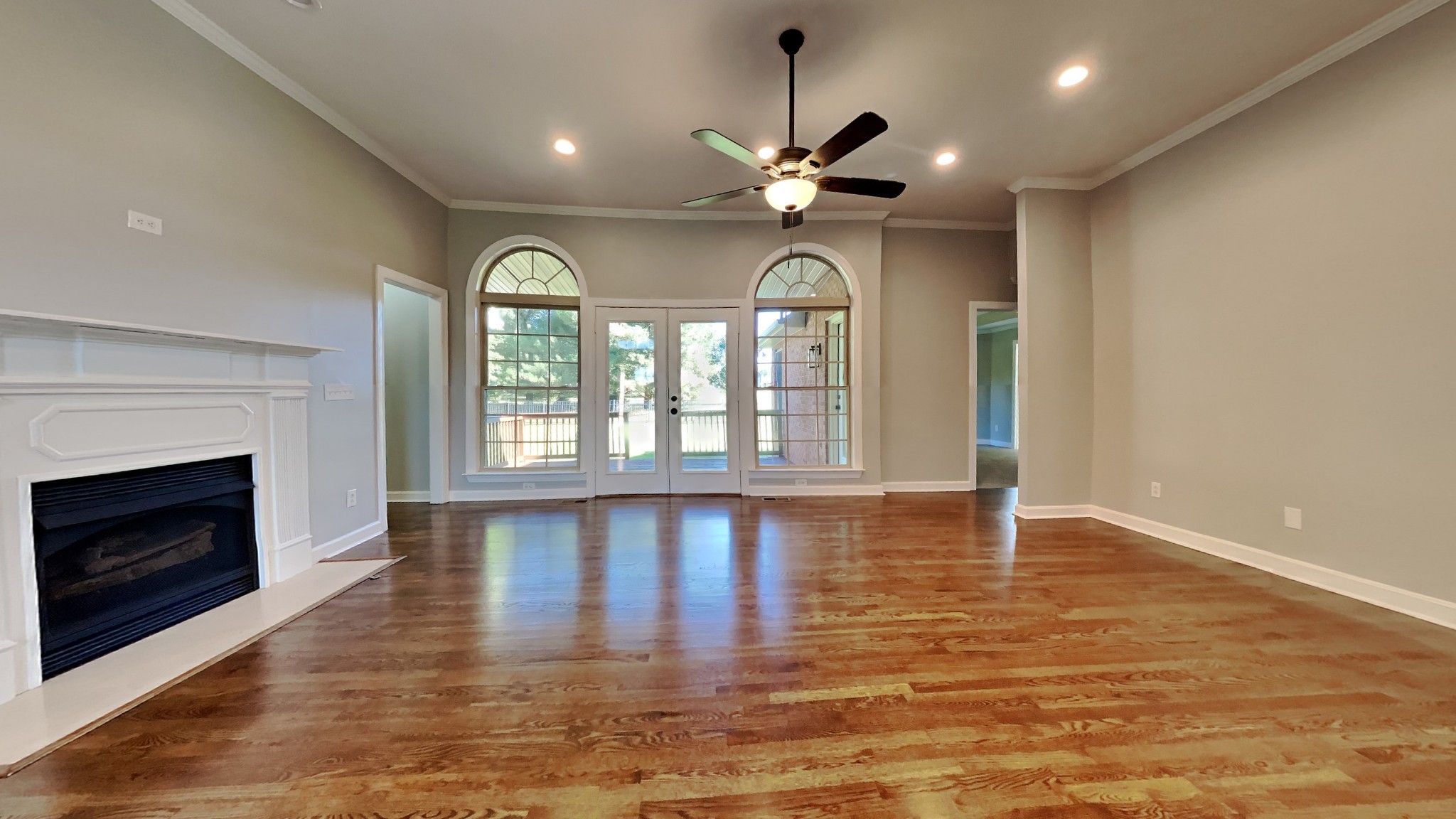 1024 Nina Drive Springfield, TN 37172 - Photo 3 of 16 a view of empty room with wooden floor and fireplace