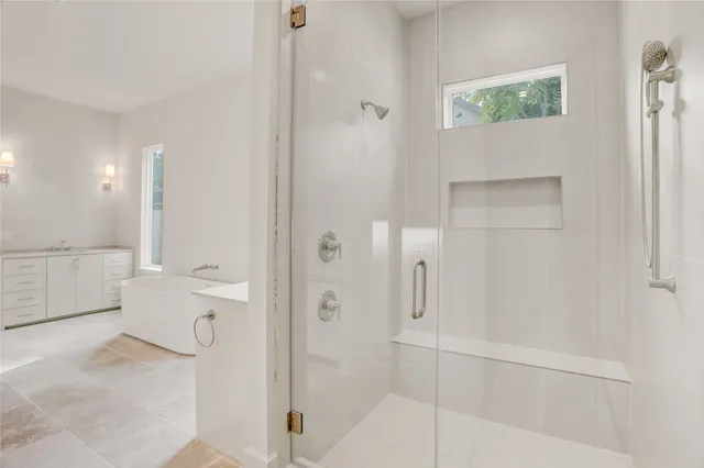 a view of staircase with white walls and a window