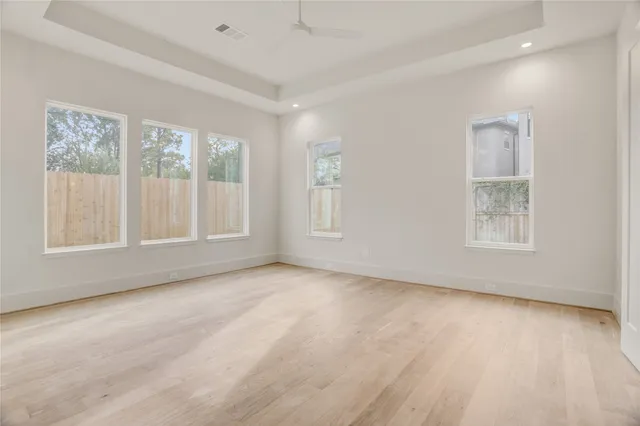 a bathroom with a tub shower and sink