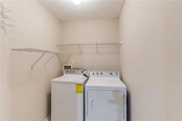 a view of a big room with windows and closet