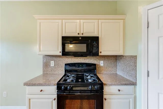 a view of an empty room with glass door