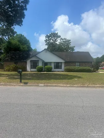 a house with swimming pool in front of it