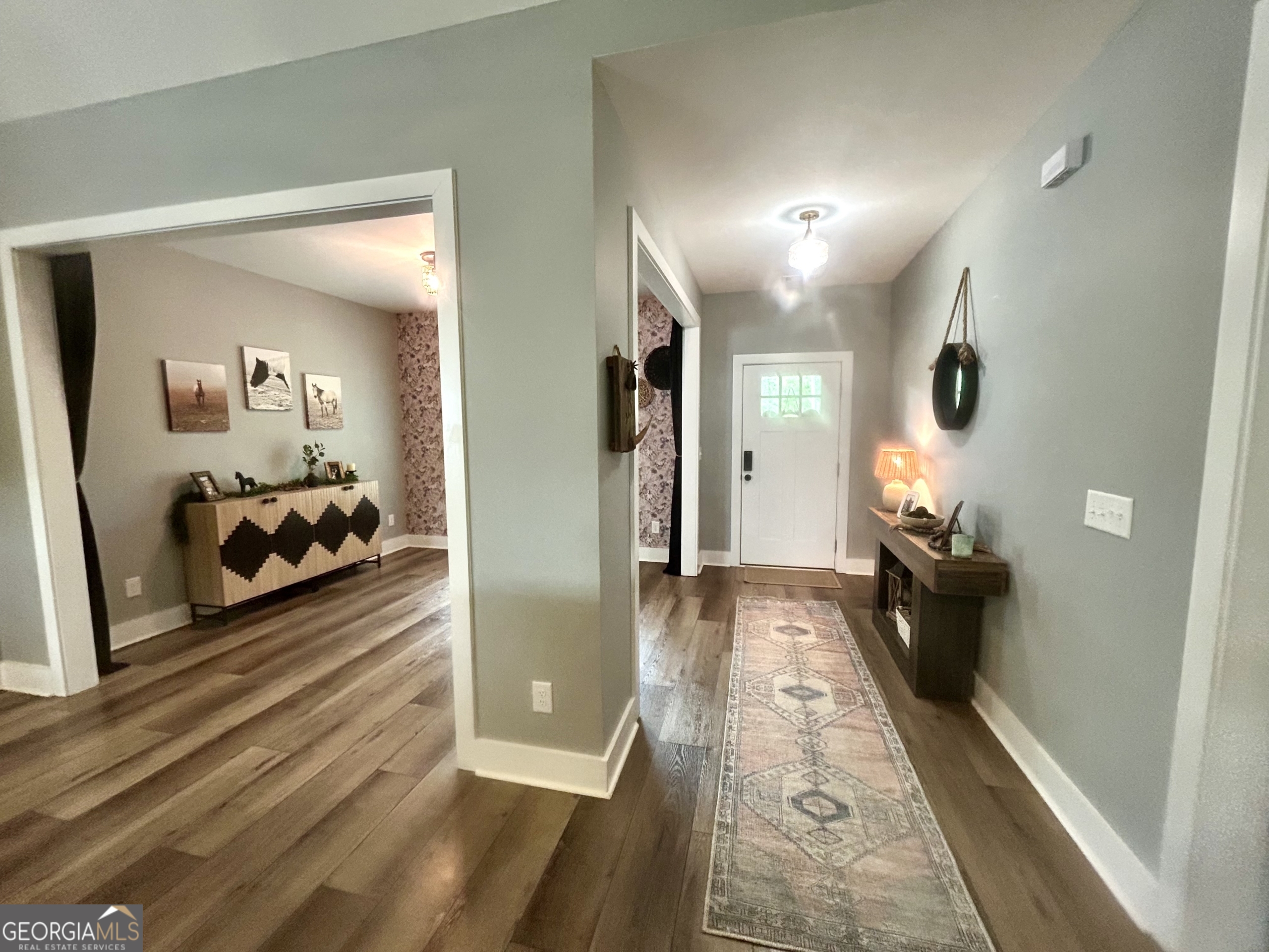 1250 Godfrey Road Madison, GA 30650 - Photo 25 of 42 a living room with furniture and a wooden floor