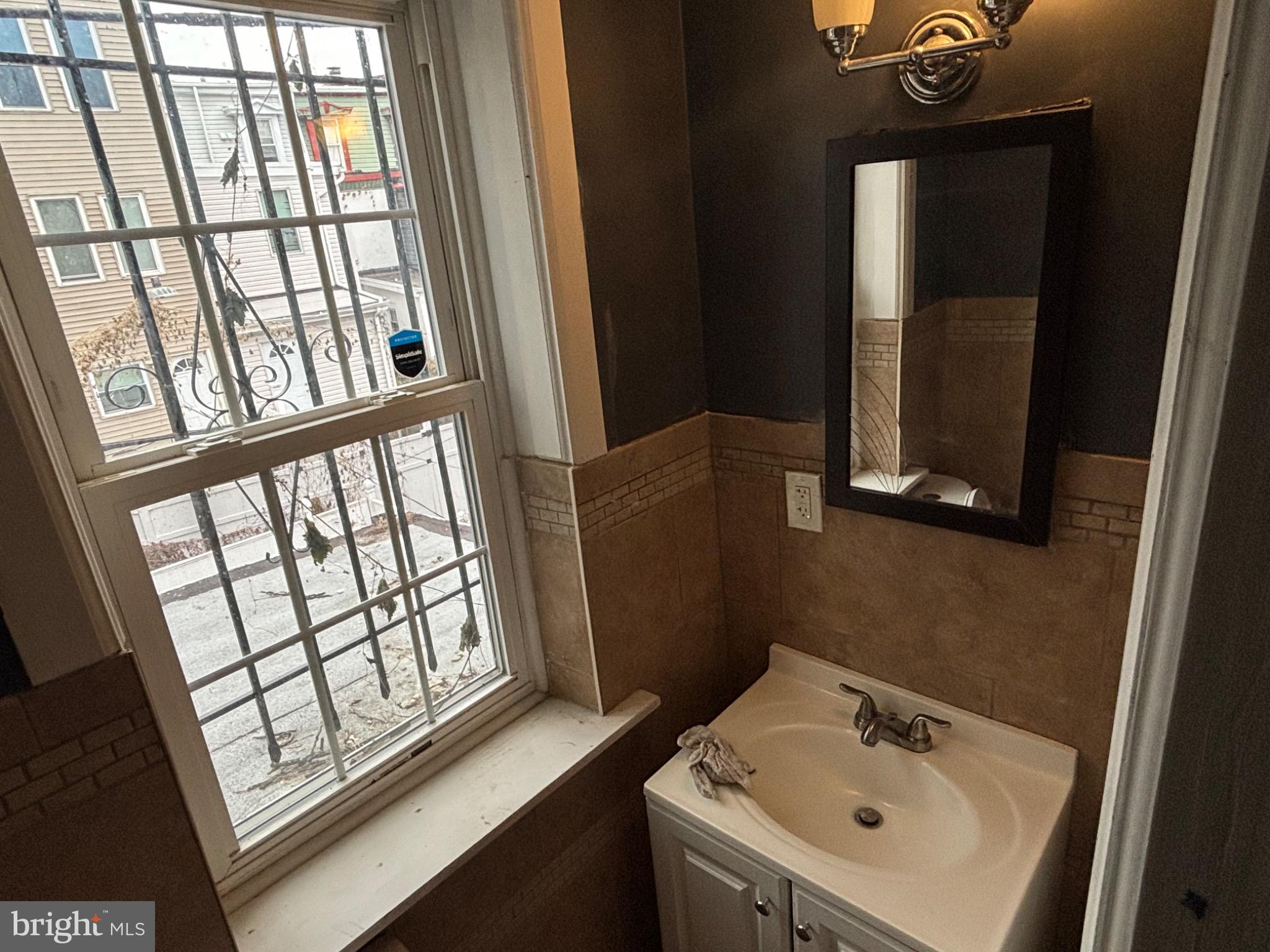 73 East Cosgrove Street Philadelphia, PA 19144 - Photo 21 of 21 a bathroom with a sink and a window