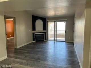 This inviting living space features a fireplace and direct access to a private patio.