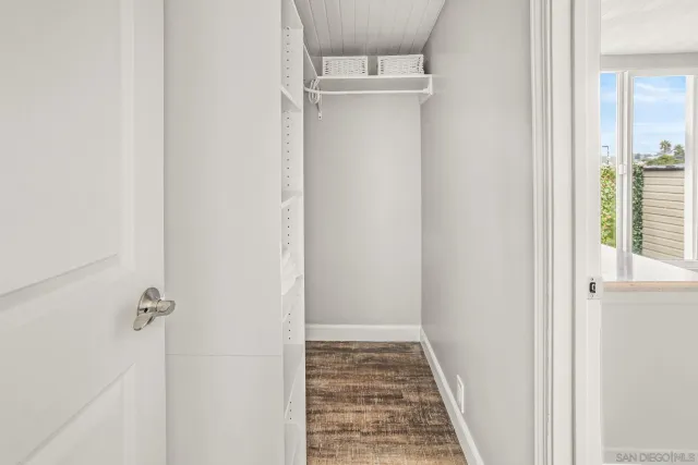 a view of a bathroom from a corridor