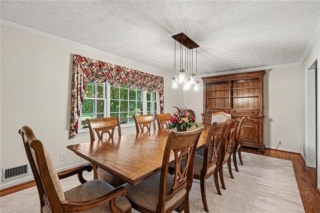 740 Smyrna Road Southwest Conyers, GA 30094 - Photo 7 of 27 a view of a dining room with furniture window and outside view