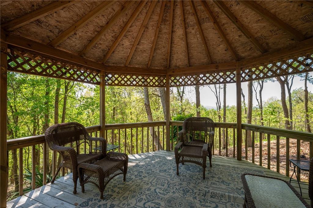 1339 Ridgeview Drive Big Canoe, GA 30143 - Photo 21 of 78 a view of a chairs and table in the balcony