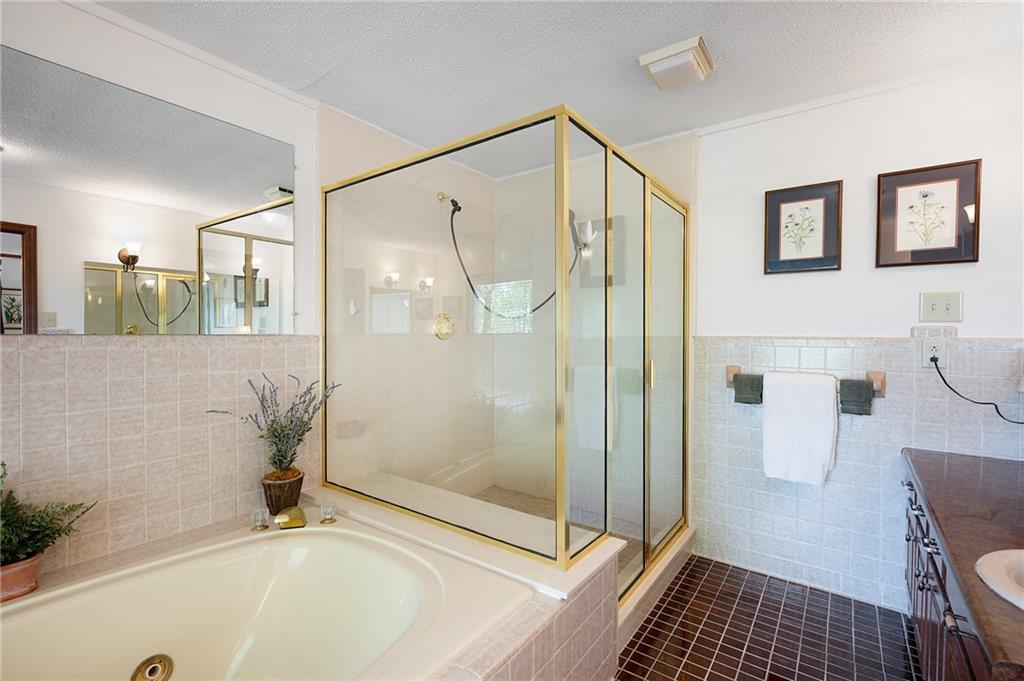 1339 Ridgeview Drive Big Canoe, GA 30143 - Photo 60 of 78 a bathroom with a bathtub and a shower
