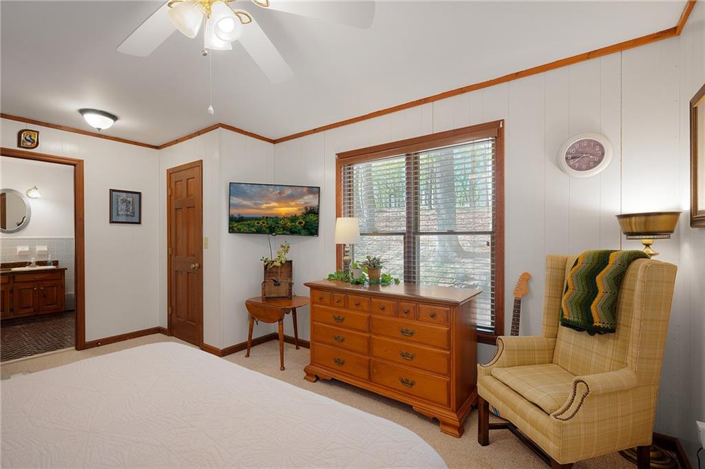 1339 Ridgeview Drive Big Canoe, GA 30143 - Photo 62 of 78 a bedroom with furniture and a flat screen tv