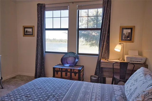 a bedroom with a bed and window