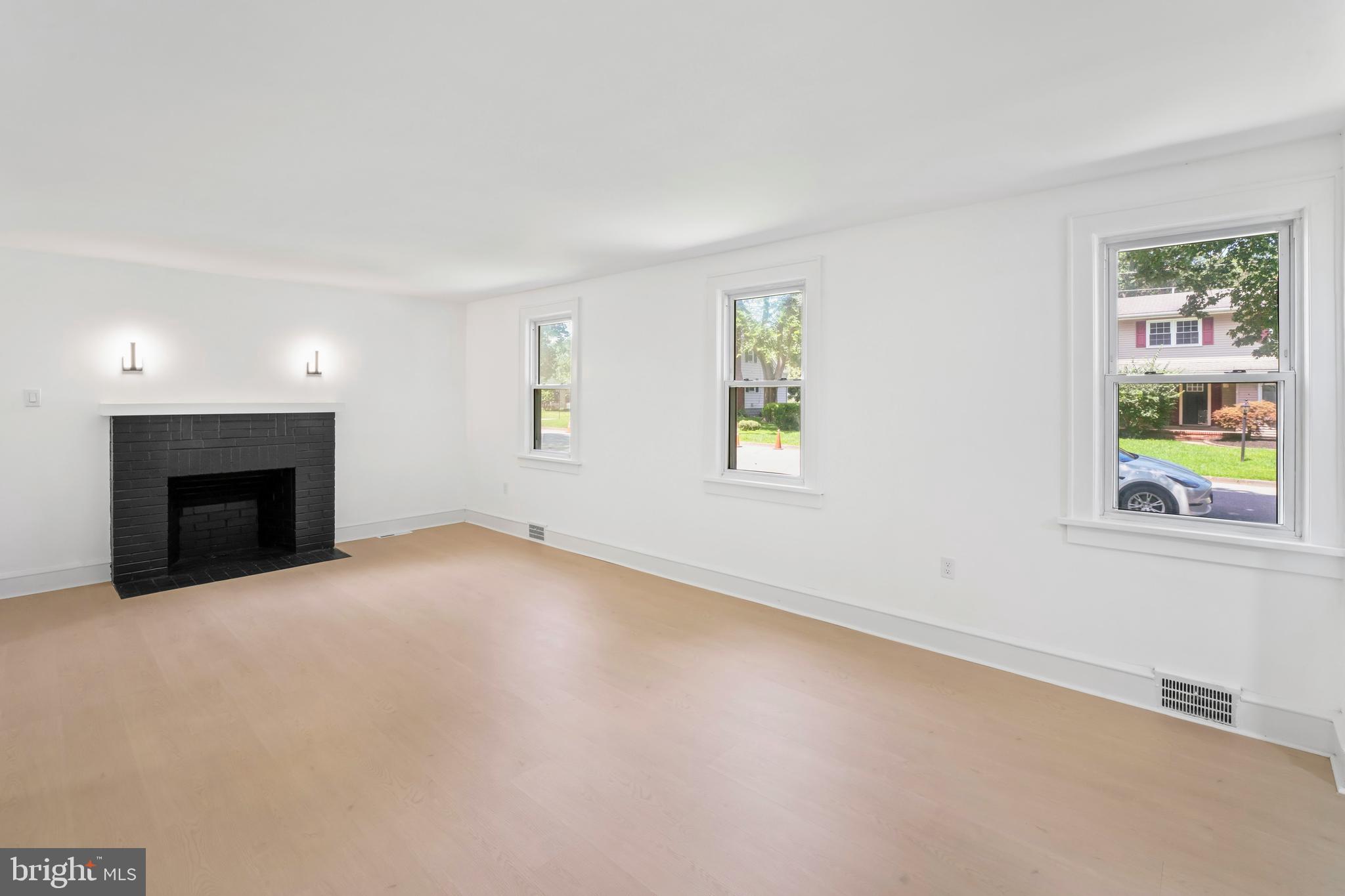 583 Orchard Road Carneys Point, NJ 08069 - Photo 20 of 62 an empty room with windows and fireplace