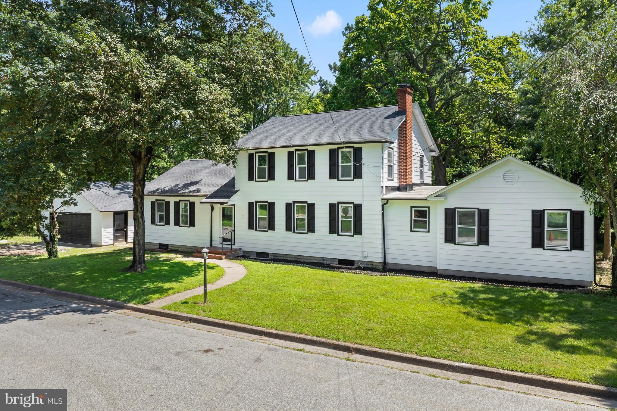 583 Orchard Road Carneys Point, NJ 08069 - Photo 2 of 62 a front view of a house with a yard and porch