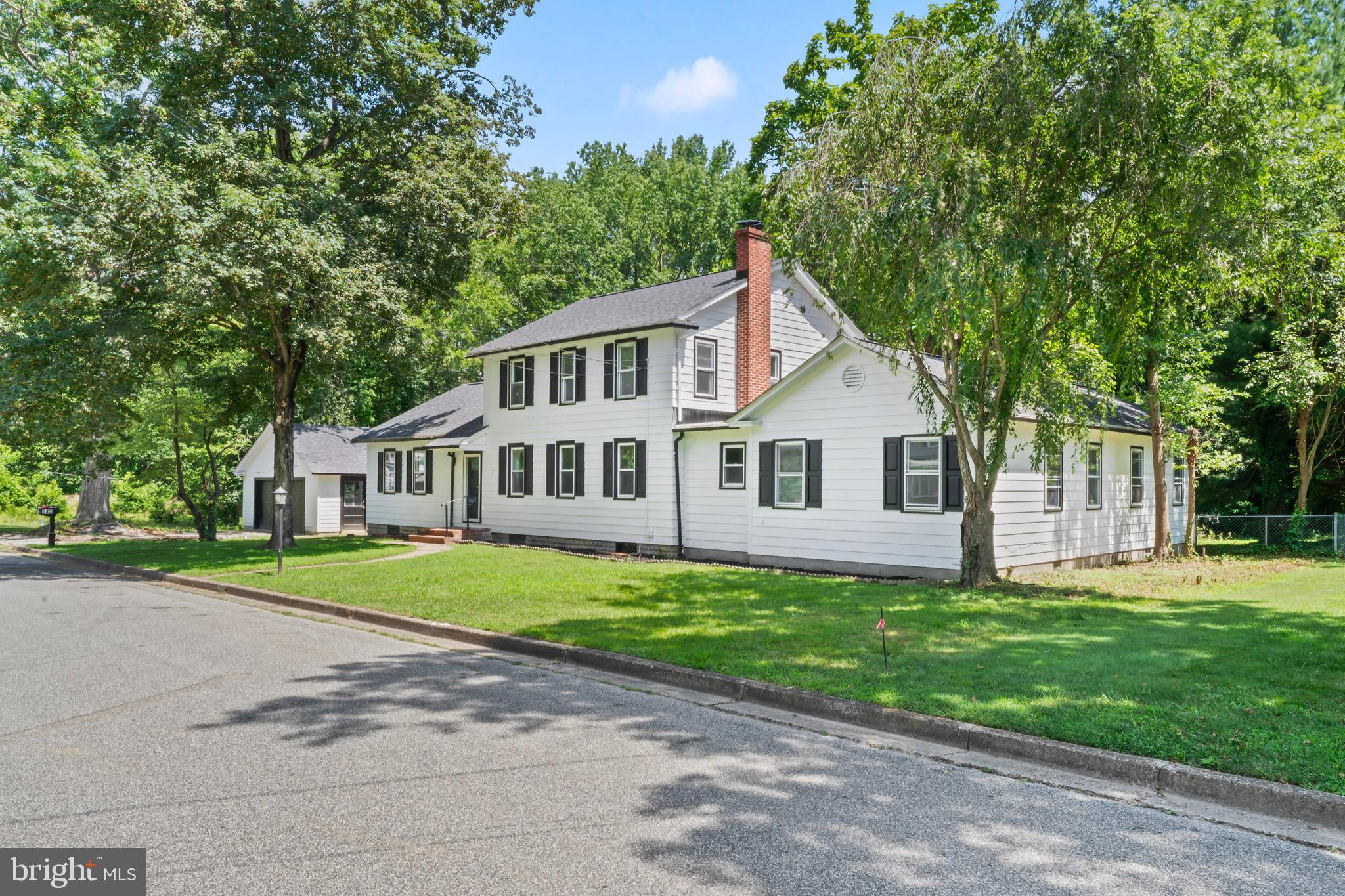 583 Orchard Road Carneys Point, NJ 08069 - Photo 3 of 62 a front view of a house with a garden and trees