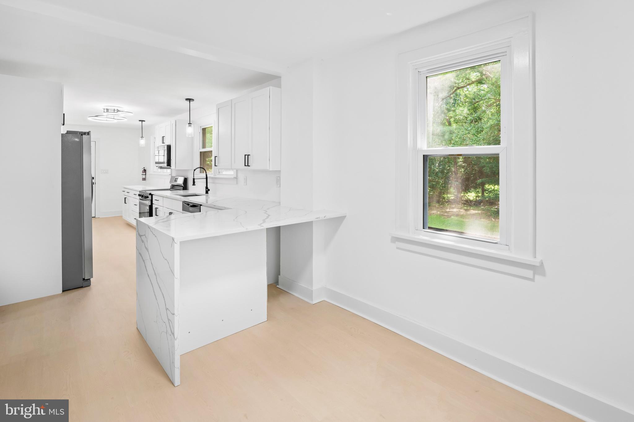 583 Orchard Road Carneys Point, NJ 08069 - Photo 35 of 62 a kitchen with a sink cabinets and a window