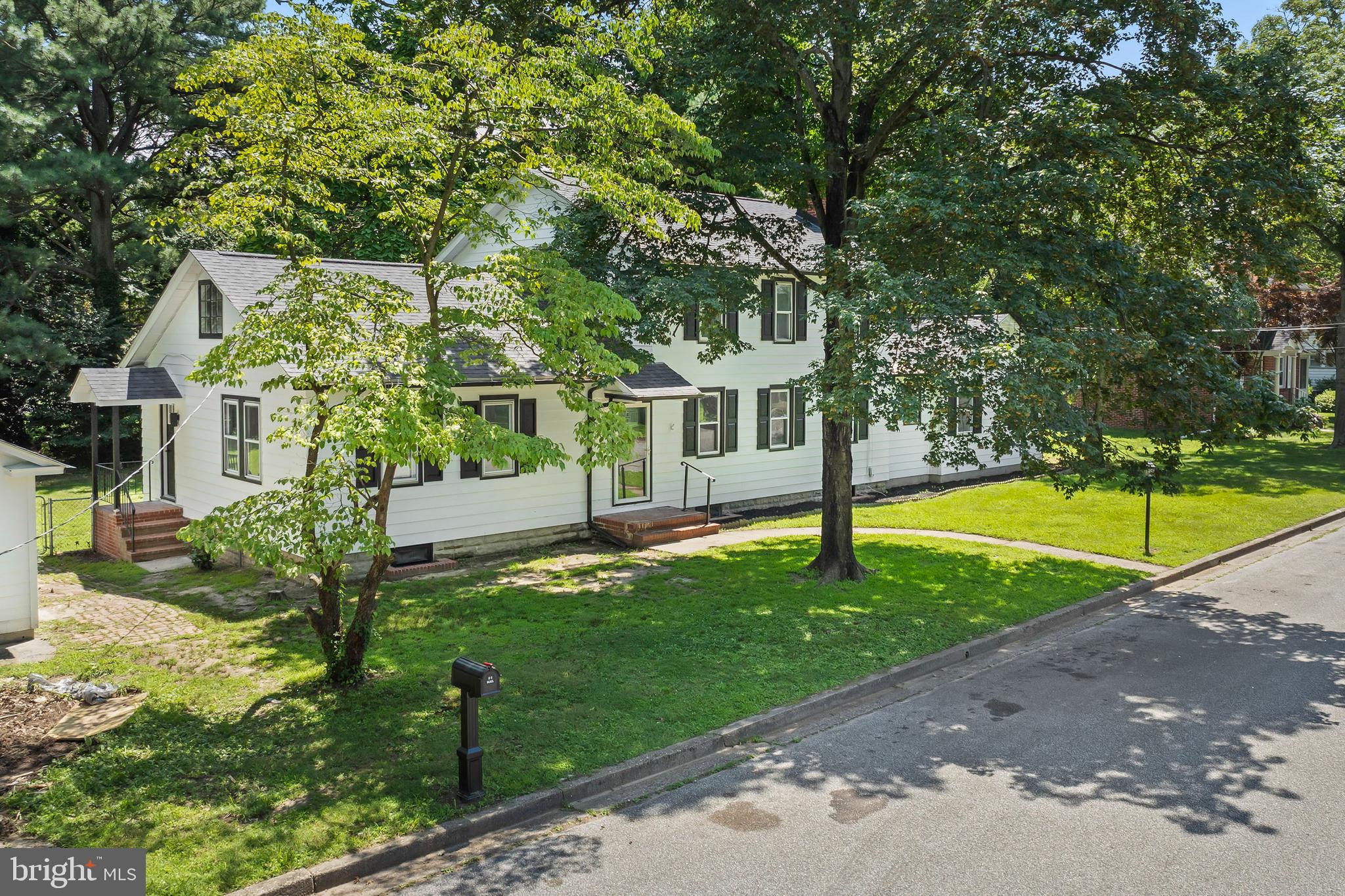 583 Orchard Road Carneys Point, NJ 08069 - Photo 4 of 62 a house with green field in front of it