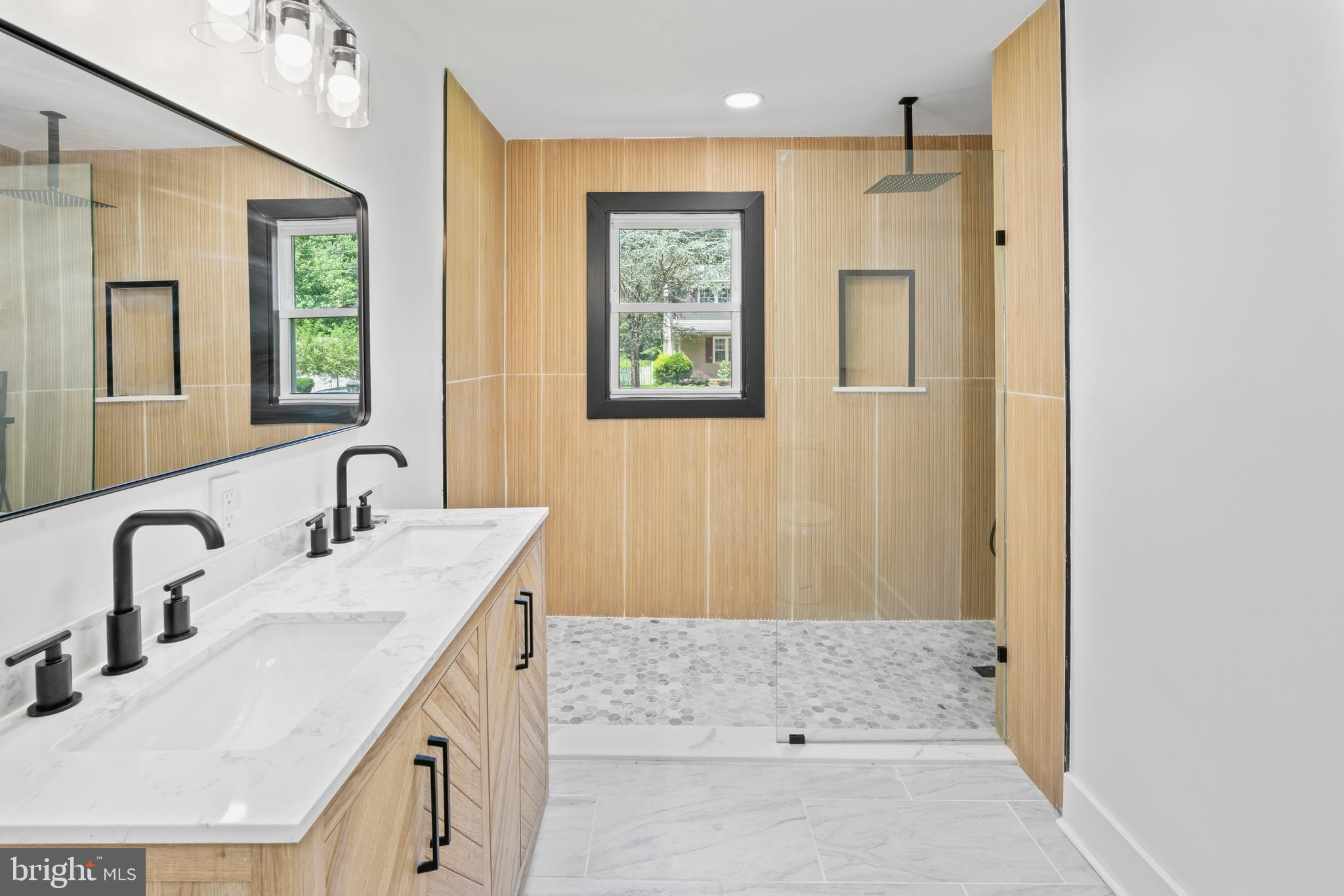 583 Orchard Road Carneys Point, NJ 08069 - Photo 42 of 62 a bathroom with a sink a mirror and a bathtub