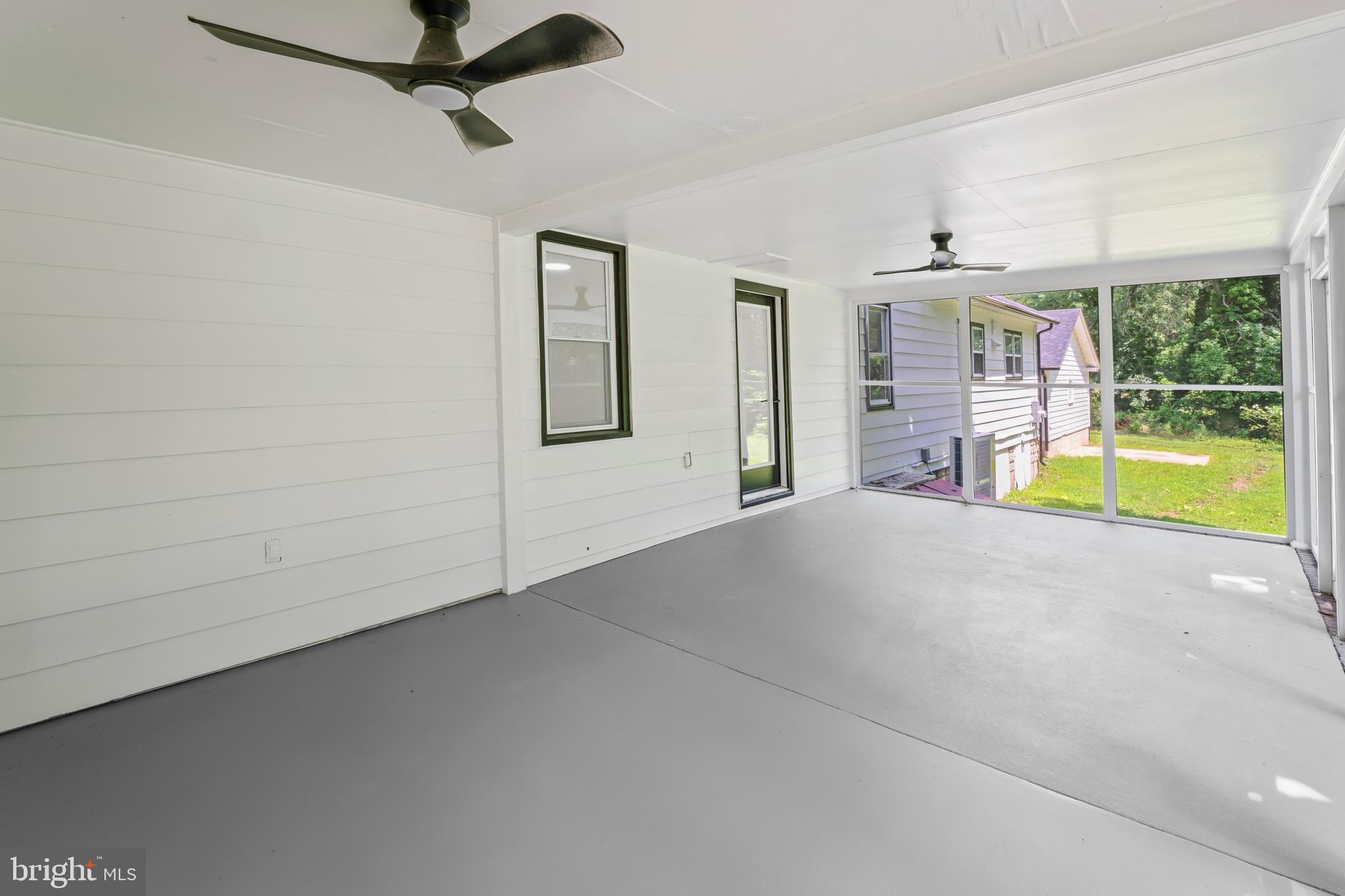 583 Orchard Road Carneys Point, NJ 08069 - Photo 53 of 62 an empty room with a ceiling fan and window