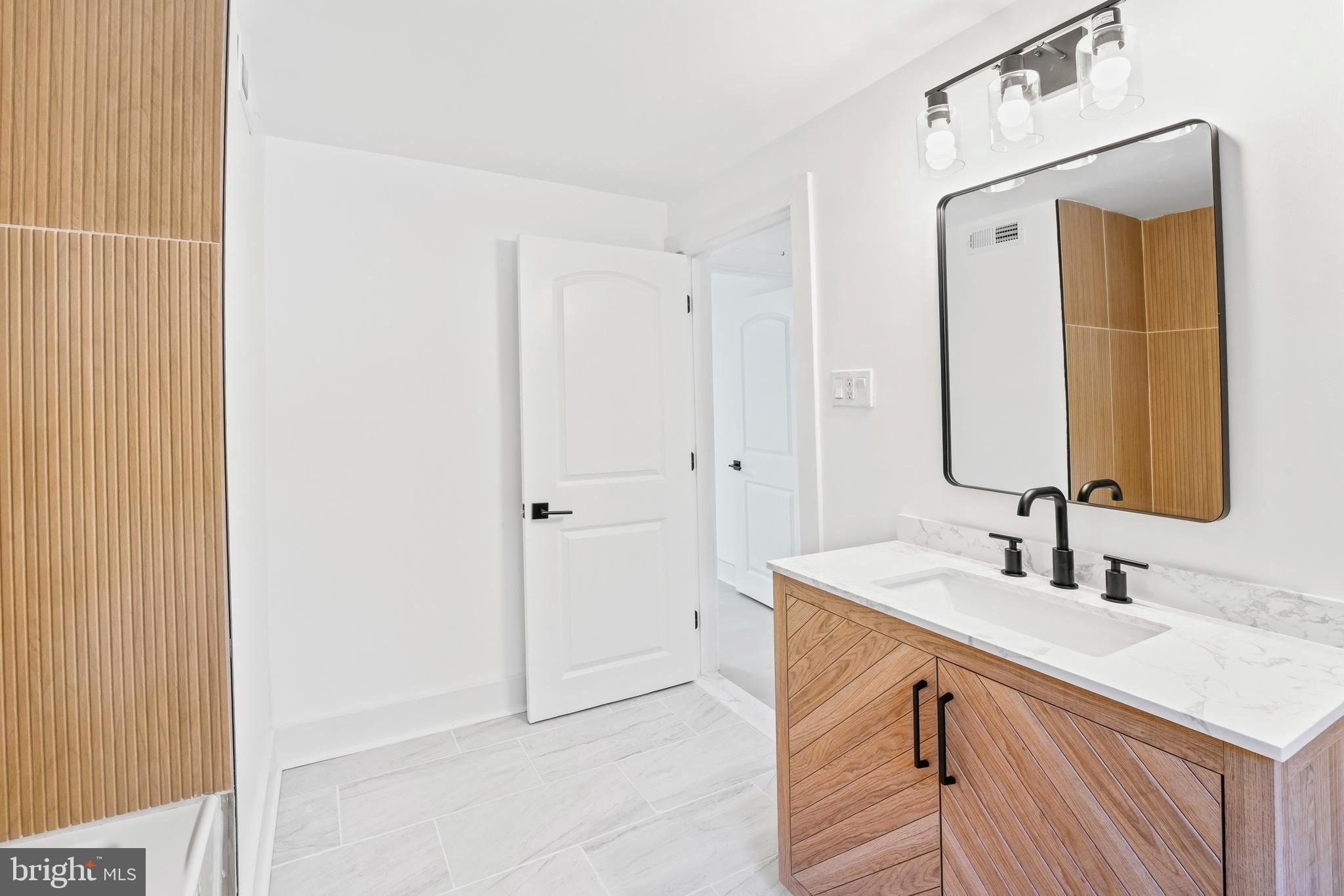 583 Orchard Road Carneys Point, NJ 08069 - Photo 61 of 62 a bathroom with a sink vanity and a mirror