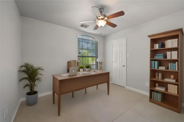 a view of a workspace with furniture