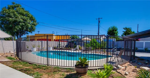 a view of a porch with a flower garden