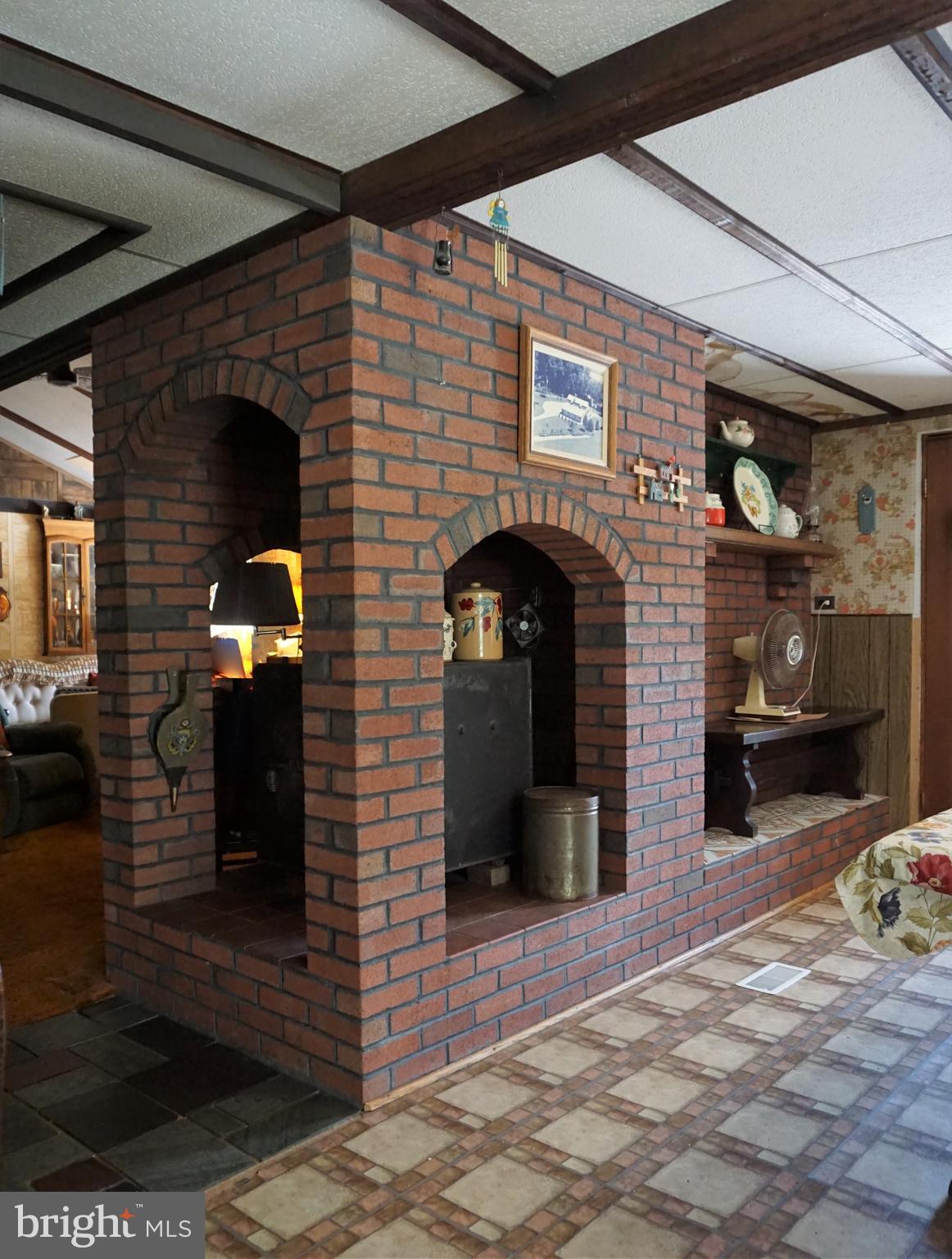325 Ness Road York, PA 17402 - Photo 31 of 43 Unique brick wood stove enclosure.