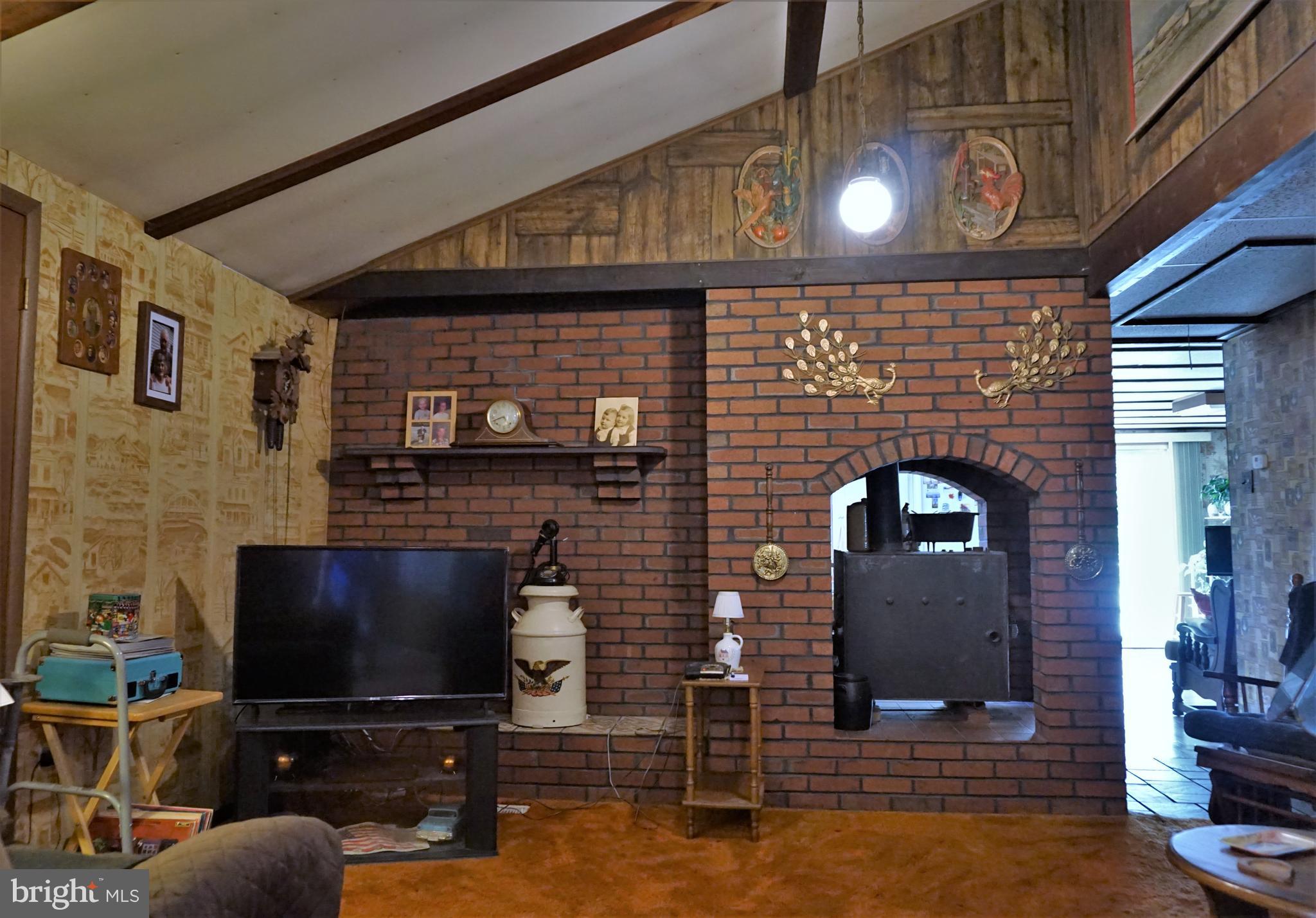 325 Ness Road York, PA 17402 - Photo 33 of 43 Living room with brick hearth.