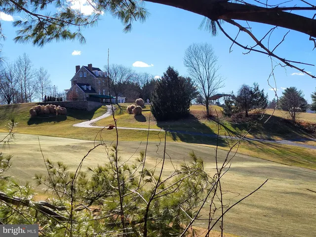 a view of swimming pool with a patio