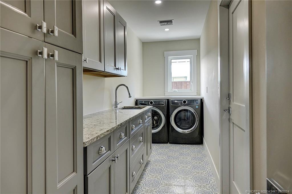 55 North Sewalls Point Road Sewall's Point, FL 34996 - Photo 26 of 49 Light and bright laundry room, lot's of storage