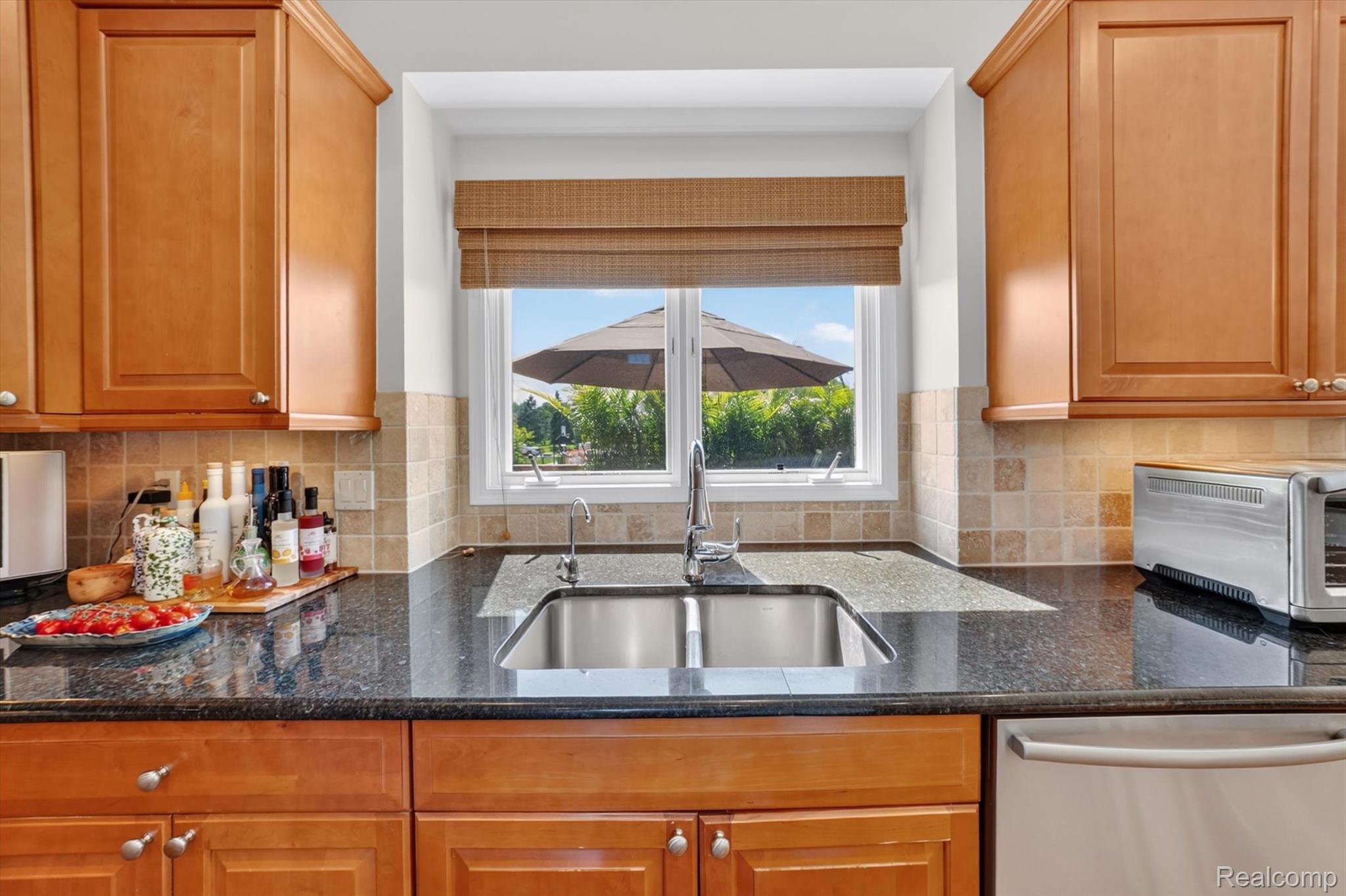 3804 Elk Drive Rochester, MI 48306 - Photo 14 of 75 Kitchen with so much LED recessed lighting and natural lighting overlooking the backyard.
