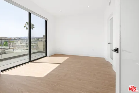 a view of a room with floor to ceiling windows