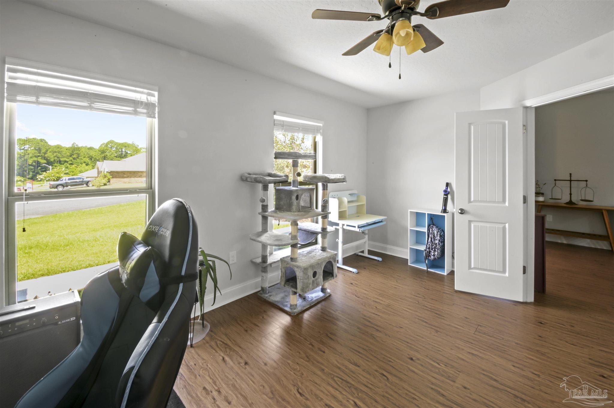 300 Cassady Lane Crestview, FL 32539 - Photo 18 of 25 a view of a livingroom with furniture hardwood floor and a window