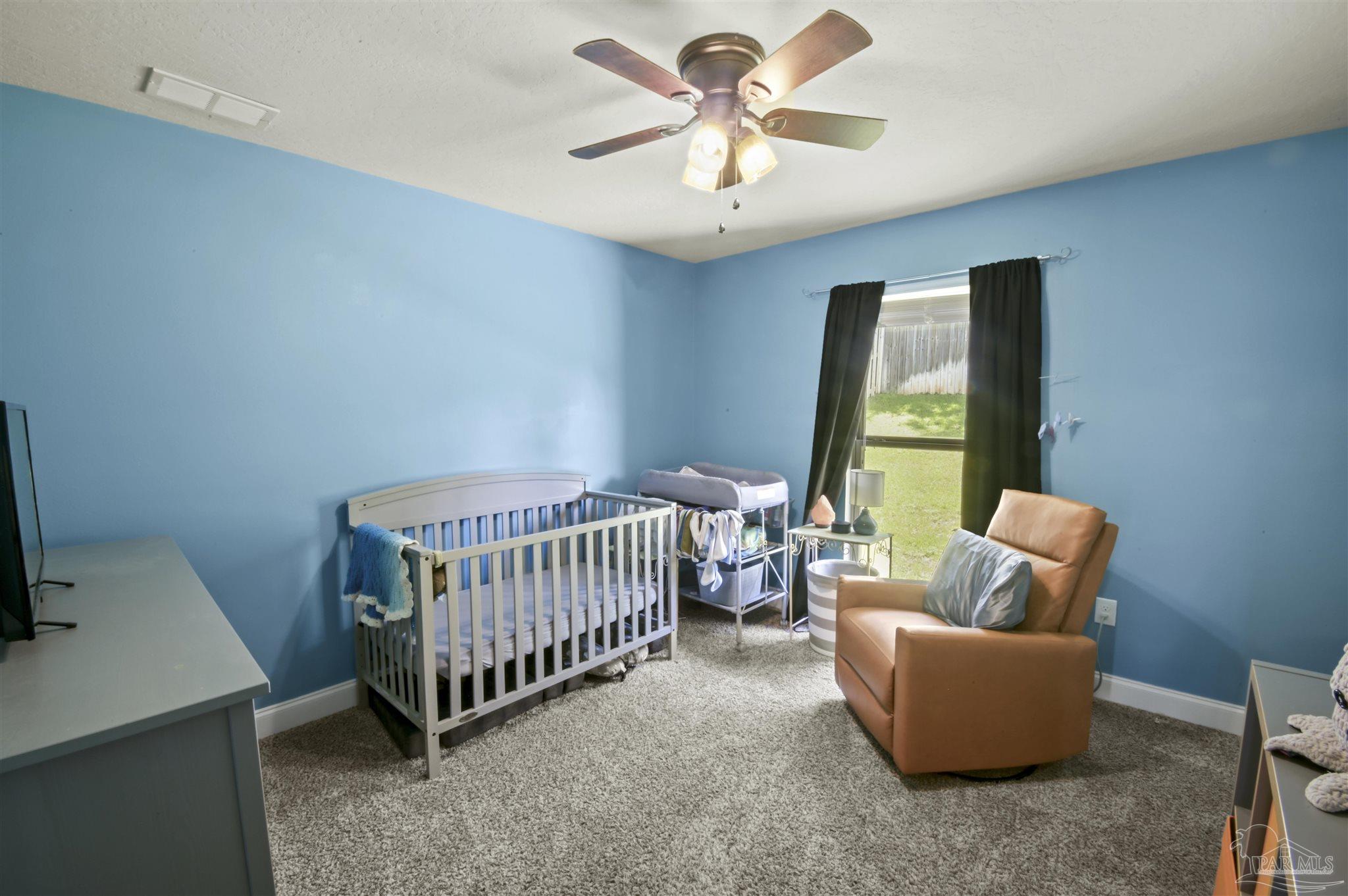 300 Cassady Lane Crestview, FL 32539 - Photo 20 of 25 a bedroom with furniture and a window