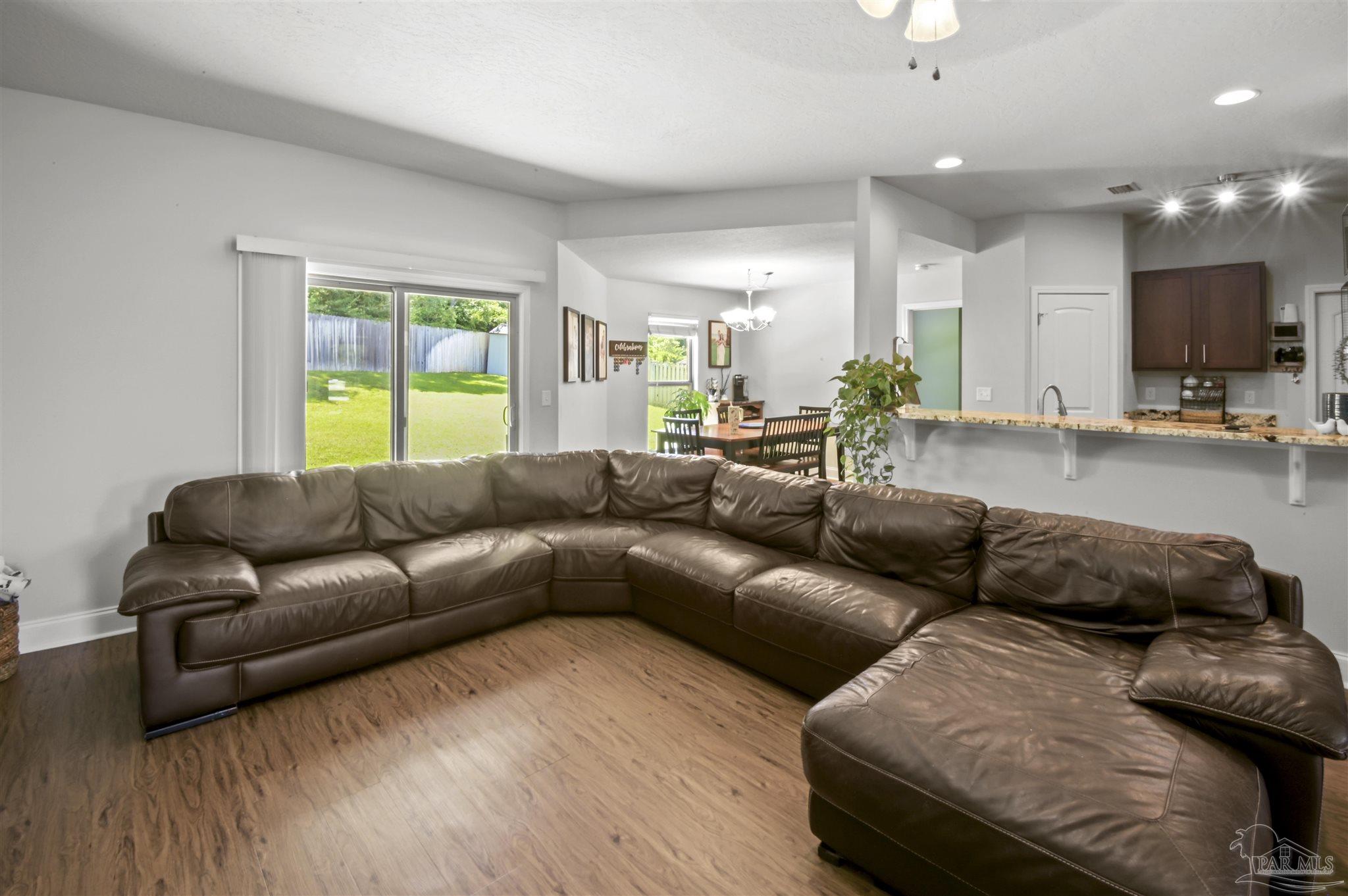 300 Cassady Lane Crestview, FL 32539 - Photo 5 of 25 a living room with furniture and a flat screen tv