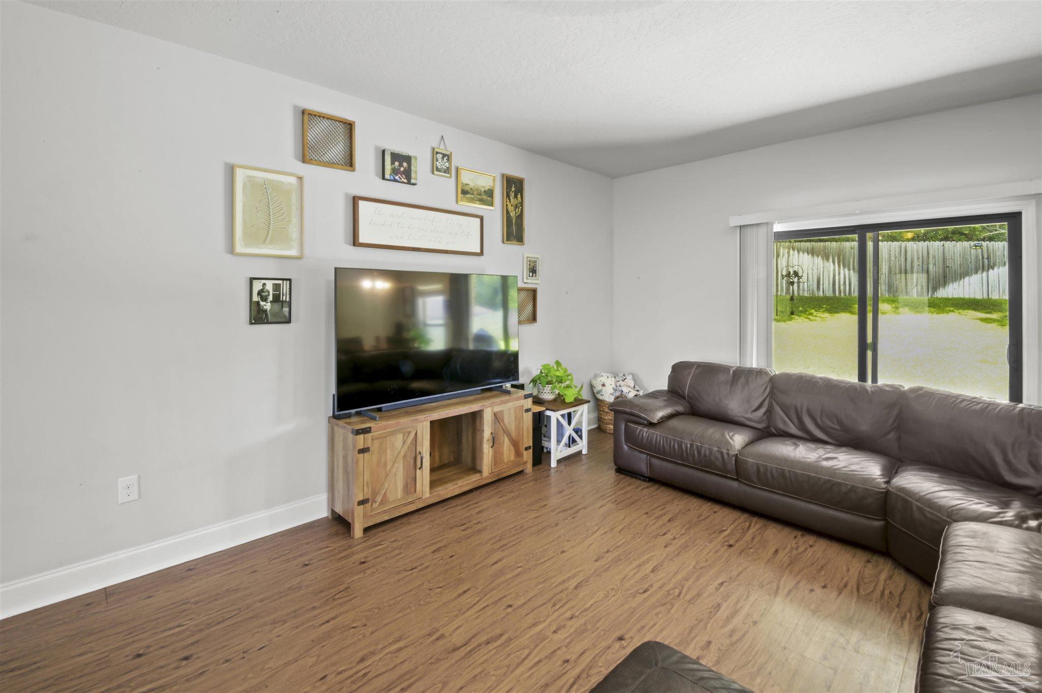 300 Cassady Lane Crestview, FL 32539 - Photo 6 of 25 a living room with furniture and a flat screen tv