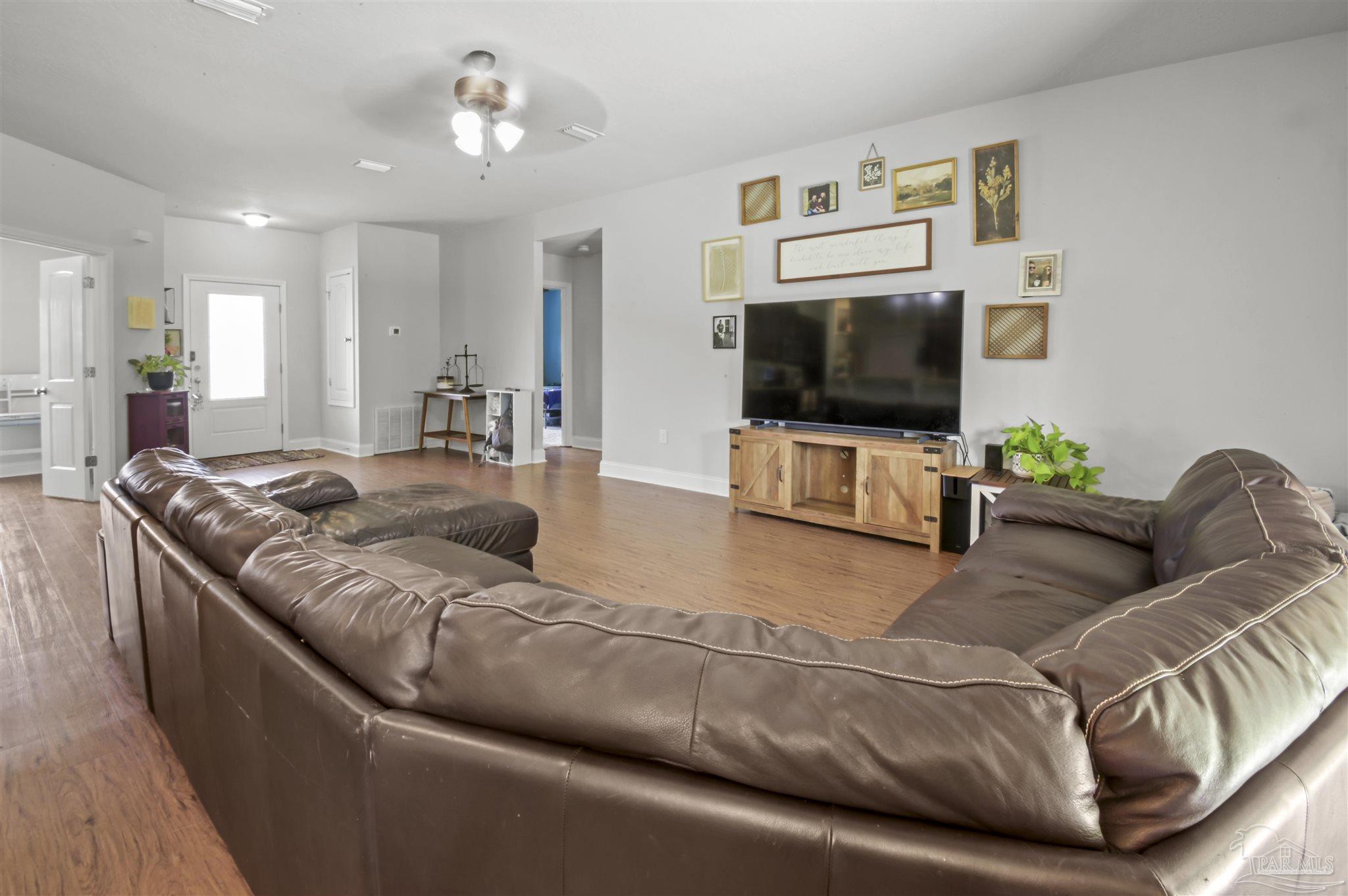300 Cassady Lane Crestview, FL 32539 - Photo 7 of 25 a living room with furniture and a flat screen tv