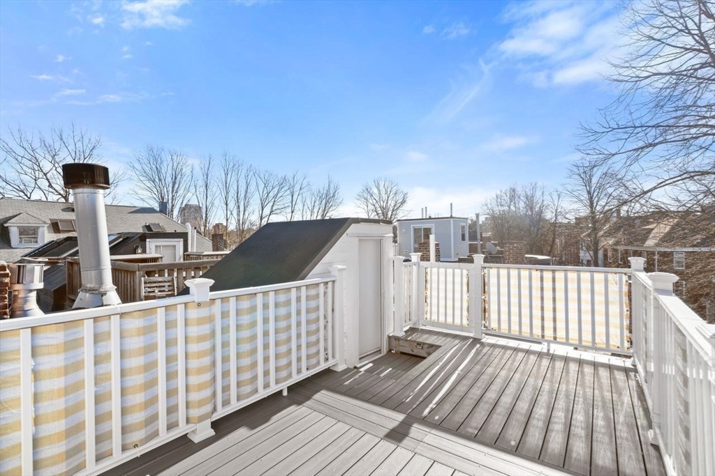 96 Brook Street, Unit 3 Brookline, MA 02445 - Photo 19 of 32 a view of balcony with wooden floor and fence