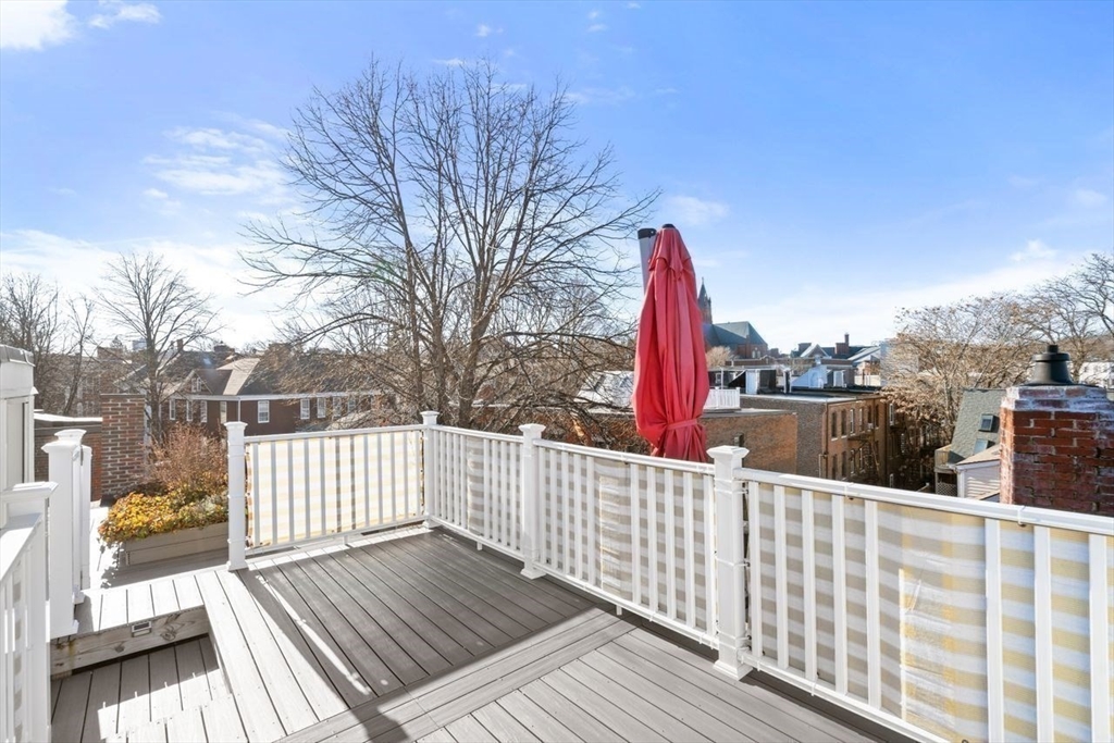 96 Brook Street, Unit 3 Brookline, MA 02445 - Photo 20 of 32 a view of a roof deck with wooden fence and floor
